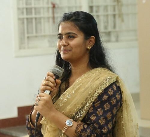 Reshma, a professional Neurobics trainer and Couple Coach, smiling confidently in a professional setting.